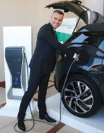 Country president, Eric L&#233;ger recharging the BMW i3 electric vehicle.